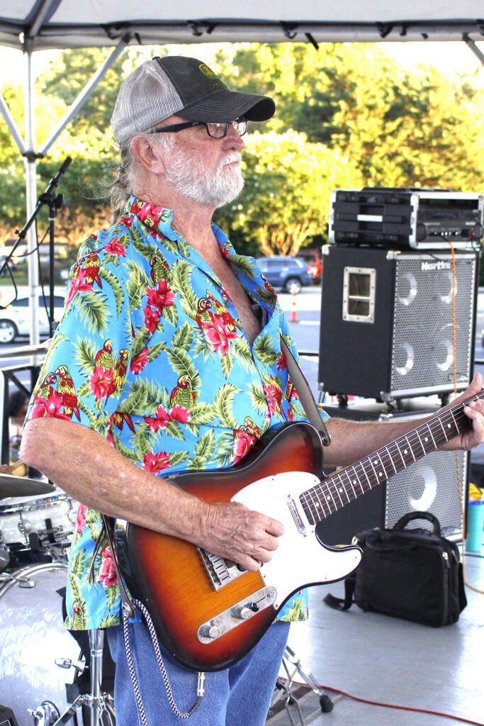 James playing Fender Telecaster wearing Hawaiian shirt the band silver